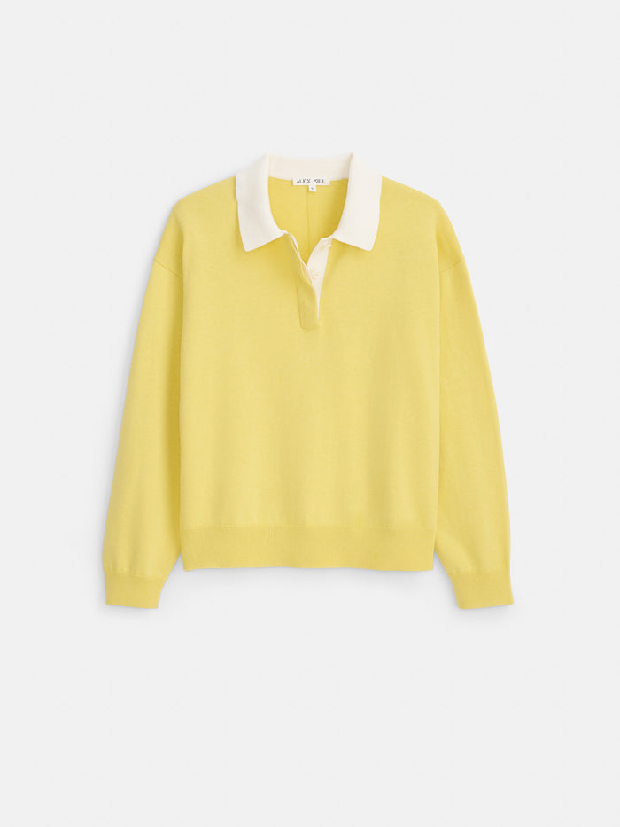 The Bond St Polo In Cotton Cashmere is an oversized, long-sleeve yellow rugby-style pullover featuring a white collar and a partial button placket, presented against a plain white background.