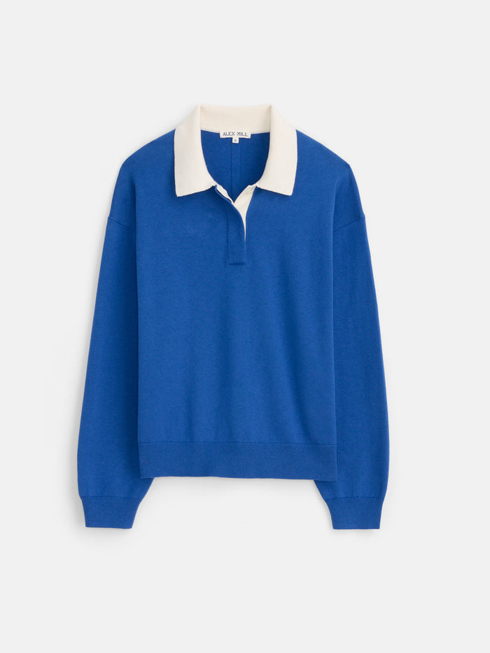 The Bond St Polo In Cotton Cashmere is a blue oversized rugby shirt with a white collar and short button placket, crafted in a relaxed fit and shown on a plain white background.
