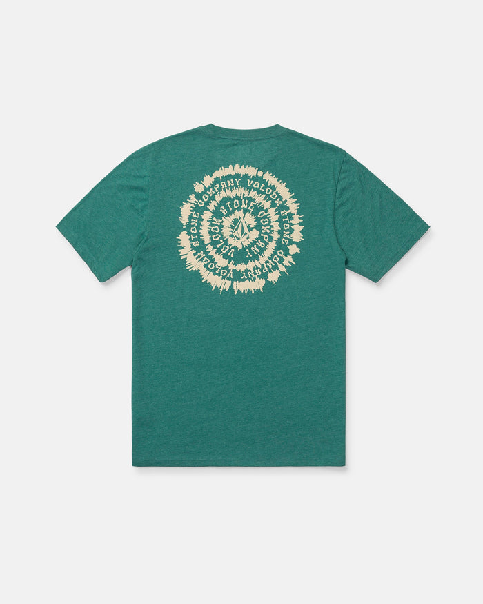 The Volcom Boy's Still Spiraling Short Sleeve Tee is a green, medium-weight t-shirt with short sleeves and a modern fit. The back features a cream-colored, circular graphic with repeating text arranged in a spiral pattern. The tee is displayed laid flat on a white background.