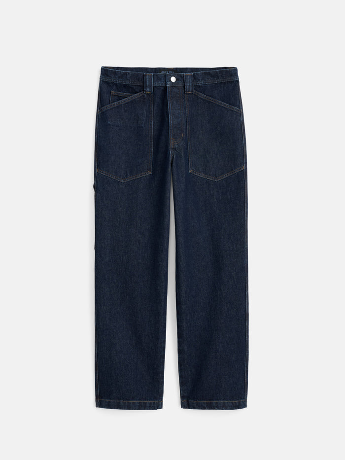Buckle Back Straight Leg Jean in dark blue features a high waist, large front patch pockets, and visible stitching that channels the classic appeal of 1940s workwear jeans, shown laid flat on a white background.