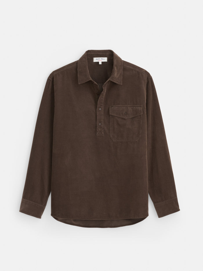 The Carter Popover in Fine Wale Corduroy is a long-sleeve, brown popover shirt made from lightweight corduroy, featuring a collar, a half button placket, and a single chest pocket, shown against a white background.