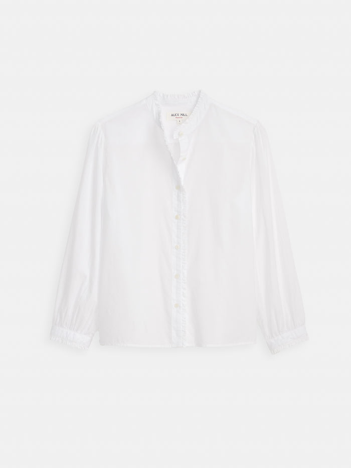 The Chantilly Ruffle Shirt in Cotton Voile is a long-sleeved, white band-collar blouse with French-inspired details, shown against a plain white background.