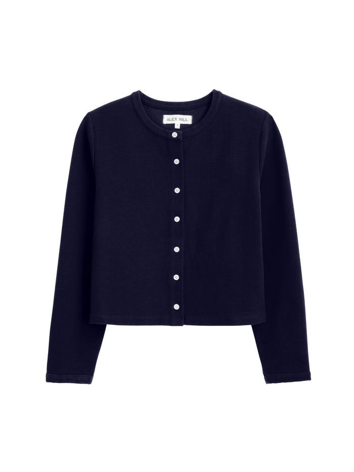 The Coco Sport Cardigan is a black, long-sleeve, button-up stretch cotton jersey cardigan with white buttons and a round neckline—ideal for pairing with Coco Pants or as part of your favorite women’s designer set.