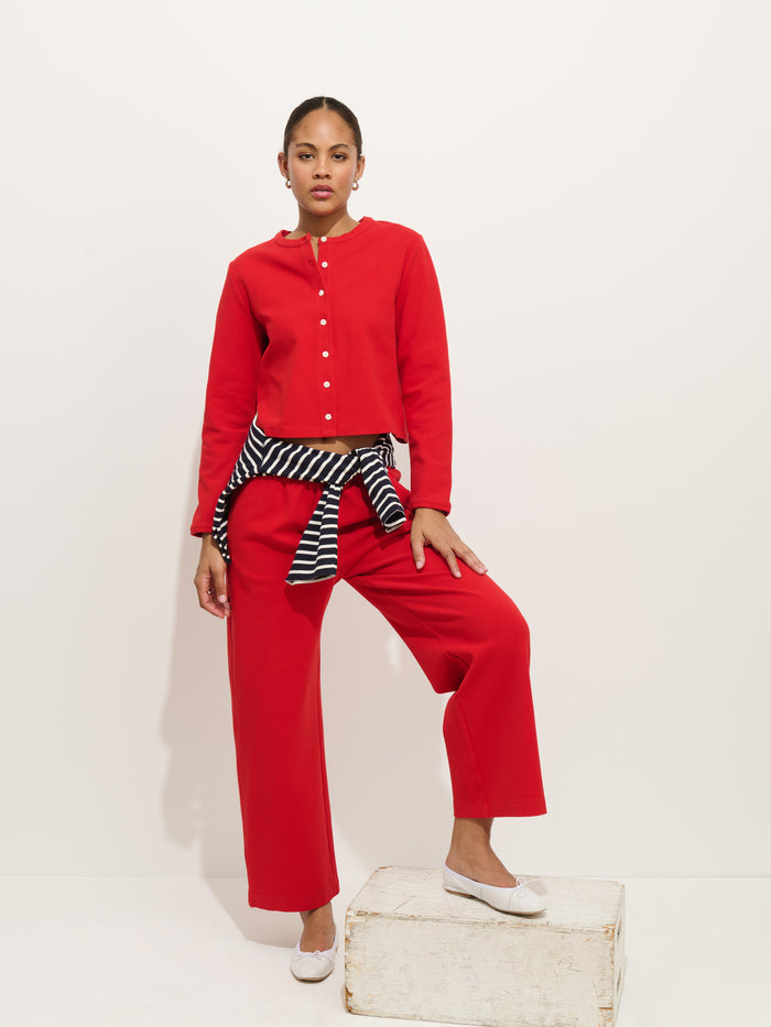 Woman wearing Coco cardigan in red with Coco Pant