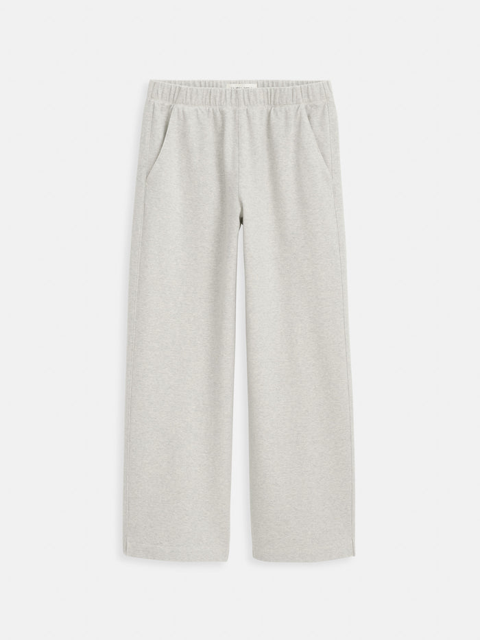 Light grey Coco Sport Pant made from cotton double jersey, featuring an elastic waistband, straight legs, and side pockets, displayed flat on a white background.