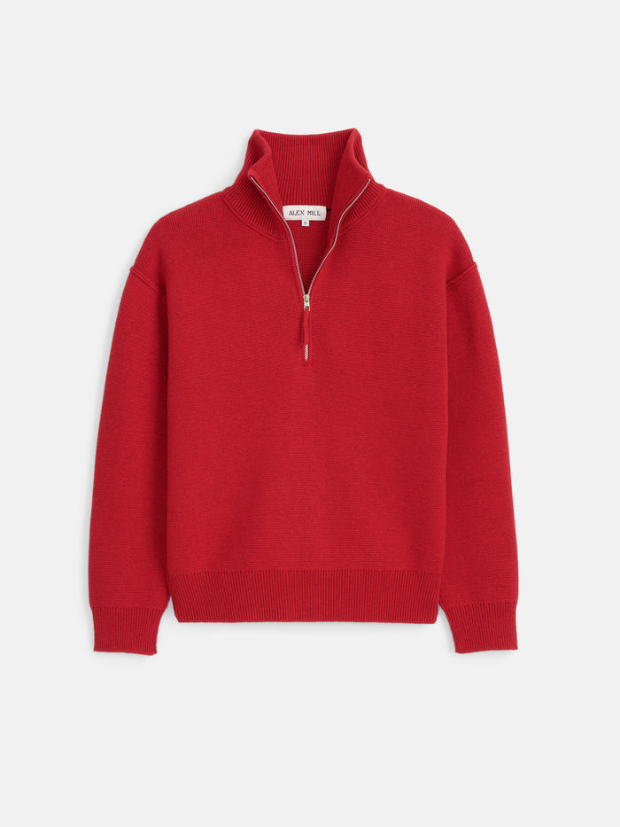 The Daphne Half-Zip Sweater in Cotton Cashmere is shown in a vibrant red hue, featuring long sleeves, a collared half-zip design, and finished with ribbed cuffs and waistband, set against a plain white background.
