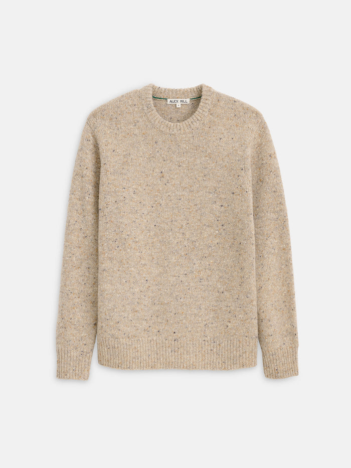 A beige speckled Donegal Crewneck Sweater with long sleeves, shown flat against a white background.