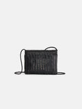 The Dragon Diffusion Pouchette Bali Large Bag is a black, hand-woven leather crossbody with a thin strap, shown against a plain white background.