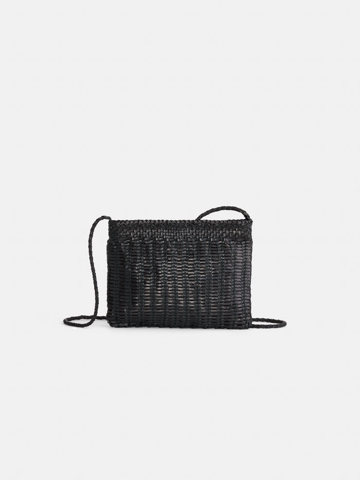 The Dragon Diffusion Pouchette Bali Large Bag is a black, hand-woven leather crossbody with a thin strap, shown against a plain white background.