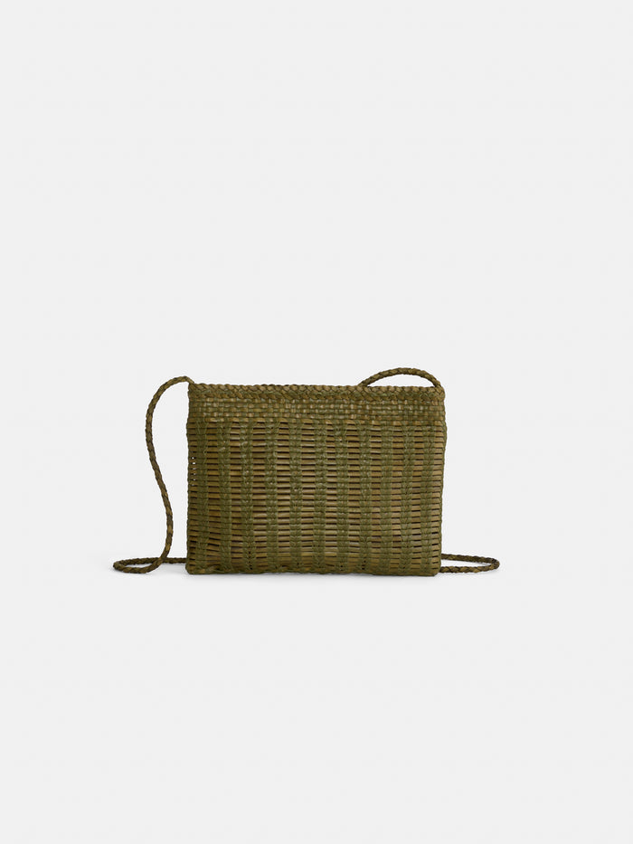 The Dragon Diffusion Pouchette Bali Large Bag is an olive green, hand-woven, rectangular leather bag with a thin braided strap and a simple, natural texture from vegetable-dyed leather, shown against a plain white background.