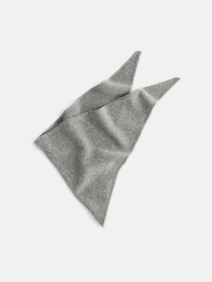 A soft, light gray Handkerchief Scarf In Wool, made from extrafine merino and featuring two pointed ends, is laid flat on a white background.