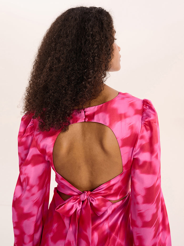 Pink floral print long sleeved maxi dress with open back with tie detail