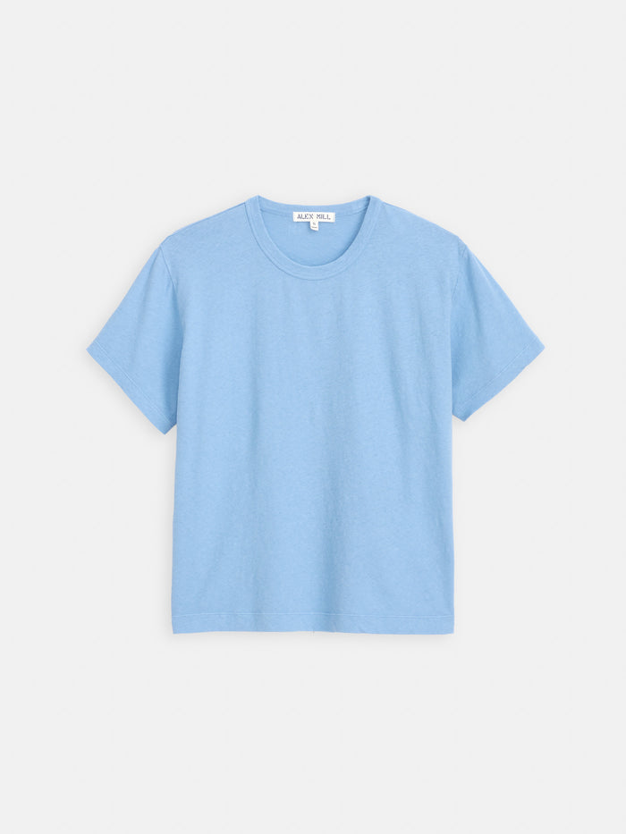 The Garcon Tee In Linen Cotton is a plain light blue, classic fit t-shirt with short sleeves and a crew neckline, displayed on a white background.
