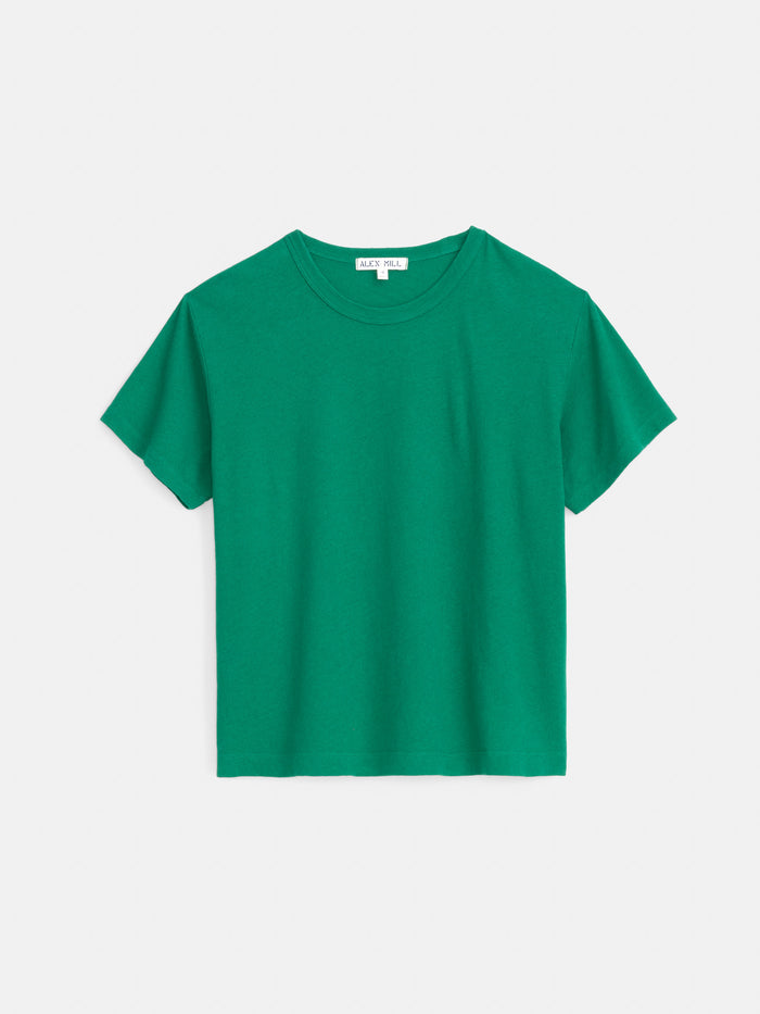 The Garcon Tee In Linen Cotton, a classic fit short-sleeve green shirt with a garment-dyed finish, is laid flat on a white background.