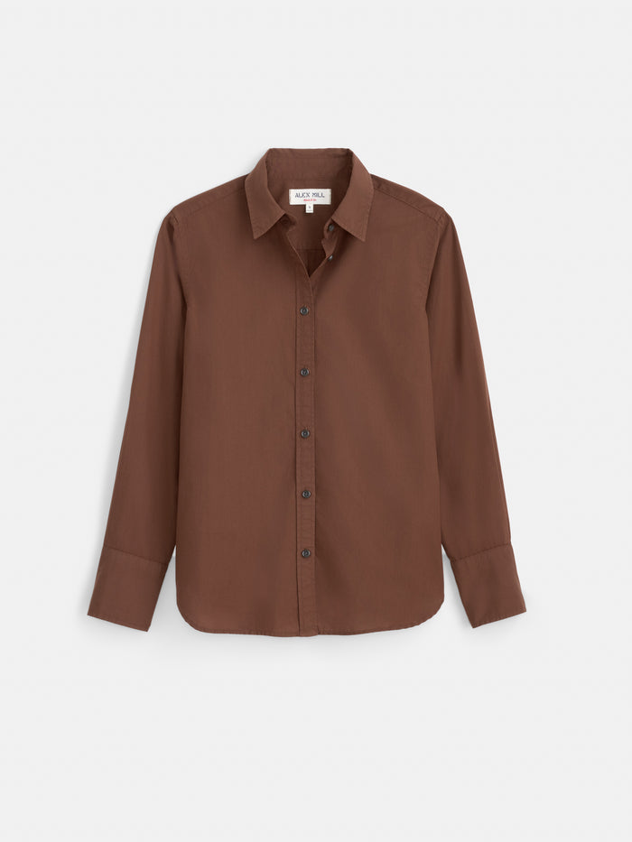 The Gracie Shirt in Poplin is a long-sleeve, classic button-up shirt in solid brown, displayed on a white background. Crafted from 100% cotton, it features a classic collar and a relaxed fit.