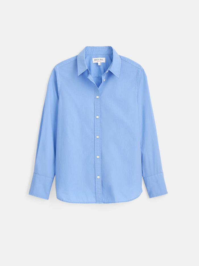 The Gracie Shirt in Poplin is a light blue, long-sleeve classic button-up with a collar, crafted from soft cotton poplin and displayed against a white background.