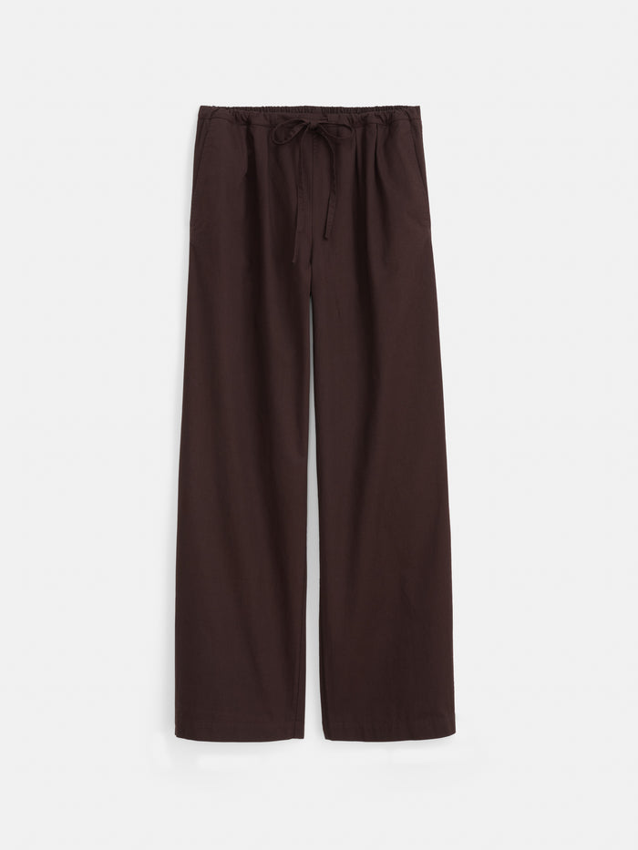 Hudson Pant In Cotton Twill, shown in dark brown with a wide-leg silhouette, features an elastic waistband with a drawstring tie, side pockets, and is crafted from lightweight cotton twill fabric. Displayed flat against a white background.