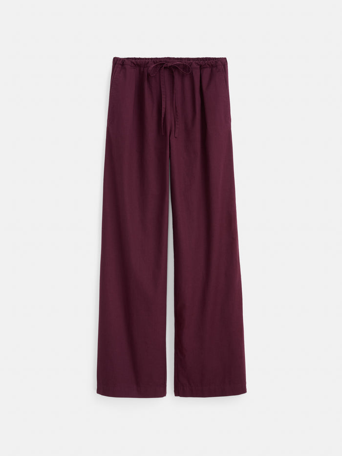 The Hudson Pant in Cotton Twill features a loose fit with wide legs, an elastic waistband with drawstring, and is crafted from comfortable cotton twill in a deep burgundy hue, shown against a white background.