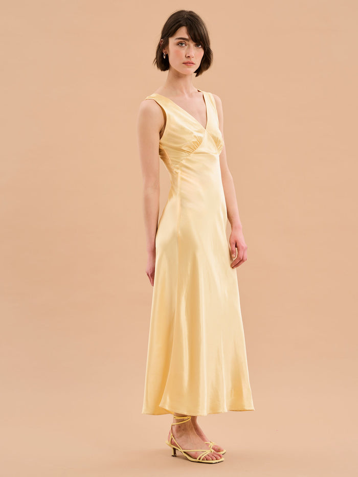 yellow satin maxi dress with v neck and ruching detail