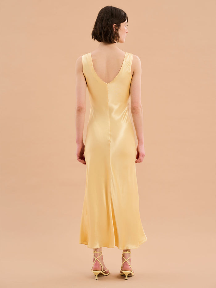 yellow satin maxi dress with v neck and ruching detail