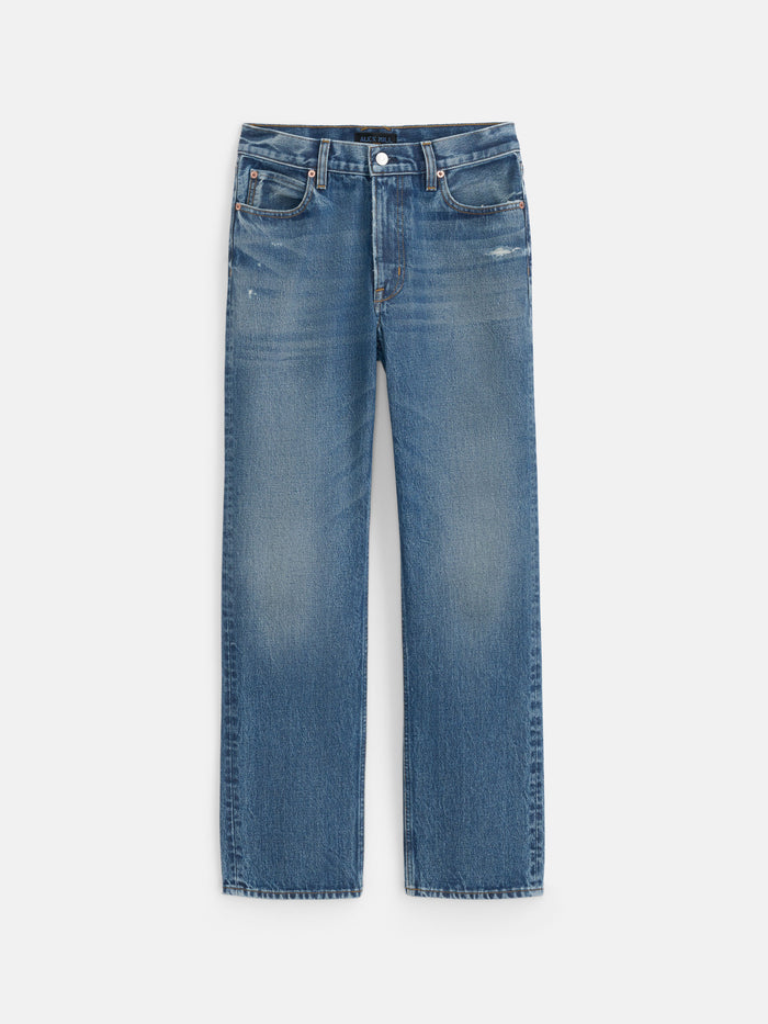 The Jane Mid-Rise Straight Jean is crafted from 100% cotton denim and features a classic button and zip fly, five-pocket design, and subtle faded detailing on the thighs and near the pockets.