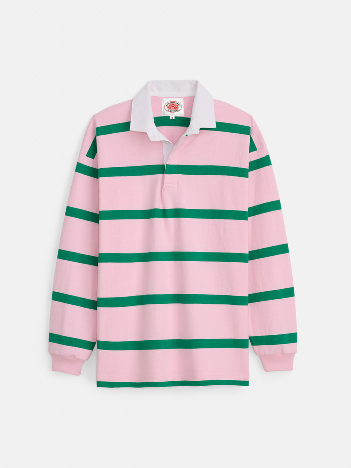 The J.Press x Alex Mill Rugby Striped Shirt in cotton features wide pink and green stripes, a white collar, and a buttonless placket, shown laid flat on a white background.