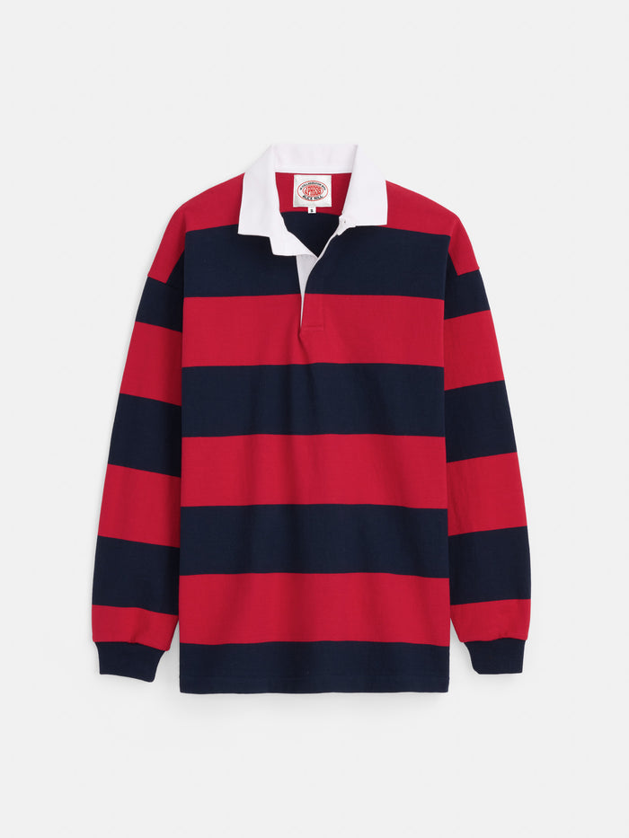 The J.Press x Alex Mill Rugby Striped Shirt In Cotton features heavyweight cotton, wide red and navy stripes, a white collar, and a buttonless placket, shown laid flat on a white background.