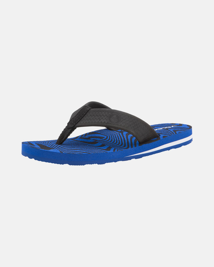 The Volcom Kids' Daycation 2 Big Youth sandal features a blue and black design with a wide black strap, textured sole, and Recliner Comfort Foam for arch support, shown on a white background.