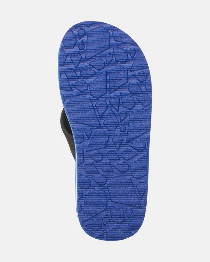 The image shows the sole of the Volcom Kids' Daycation 2 Big Youth sandal. The blue sole features Recliner Comfort Foam and a textured, geometric pattern made of angular shapes, set against a white background.
