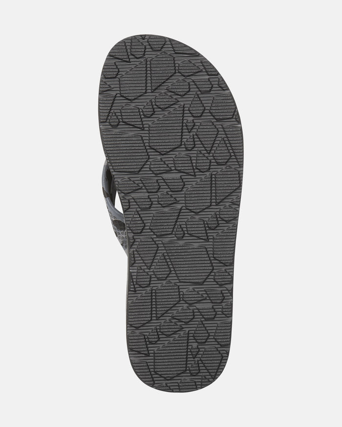 The image shows the bottom view of the Volcom Kids' Daycation 2 Big Youth sandal in gray, featuring a geometric textured tread pattern on the sole for enhanced arch support.