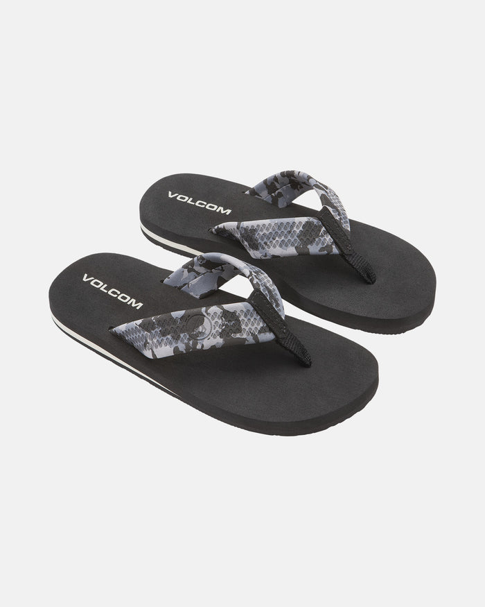 A pair of black Volcom Kids' Daycation 2 Big Youth flip-flops with gray and black patterned straps and arch support for comfort, shown on a white background.