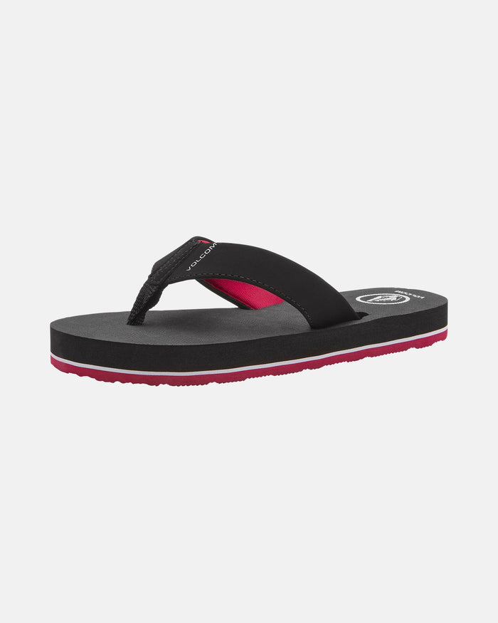 The Volcom Kids' Victor 2 Big Youth is a black, water-friendly sandal with a thick sole and red accents on the strap and lower sole, providing recliner-level comfort. Shown on a white background.