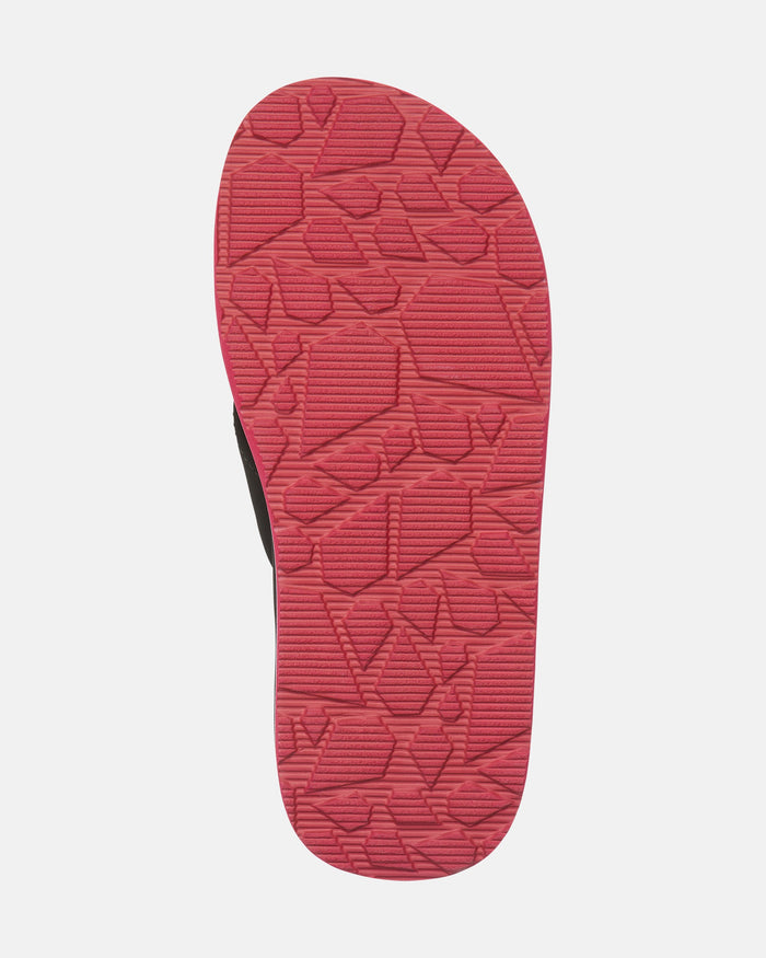 The image shows the bottom view of the Volcom Kids' Victor 2 Big Youth sandal, featuring a textured red sole with irregular geometric patterns on a white background.