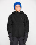 A boy wearing a blue beanie, black gloves, and the Volcom Kids’ Youth Chaos Insulated Jacket stands against a plain white background, looking straight ahead with a neutral expression.