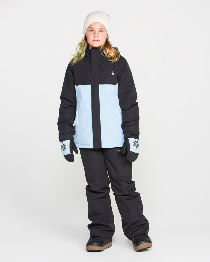 A person wearing light blue and black winter jacket, Volcom Kids’ Frostique Insulated Pants with an adjustable waist, gray gloves, brown snow boots, and a white beanie stands against a plain white background.