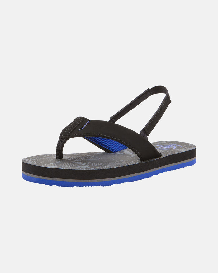 The Volcom Kids' Victor 2 Little Youth sandal in black and blue features a thick sole, black straps with blue accents, a back strap, and Recliner Comfort Foam cushioning, shown against a plain white background.