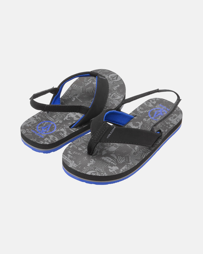 The Volcom Kids' Victor 2 Little Youth sandals feature black and blue straps, printed gray graphic footbeds, adjustable back straps, and Recliner Comfort Foam for extra cushioning.