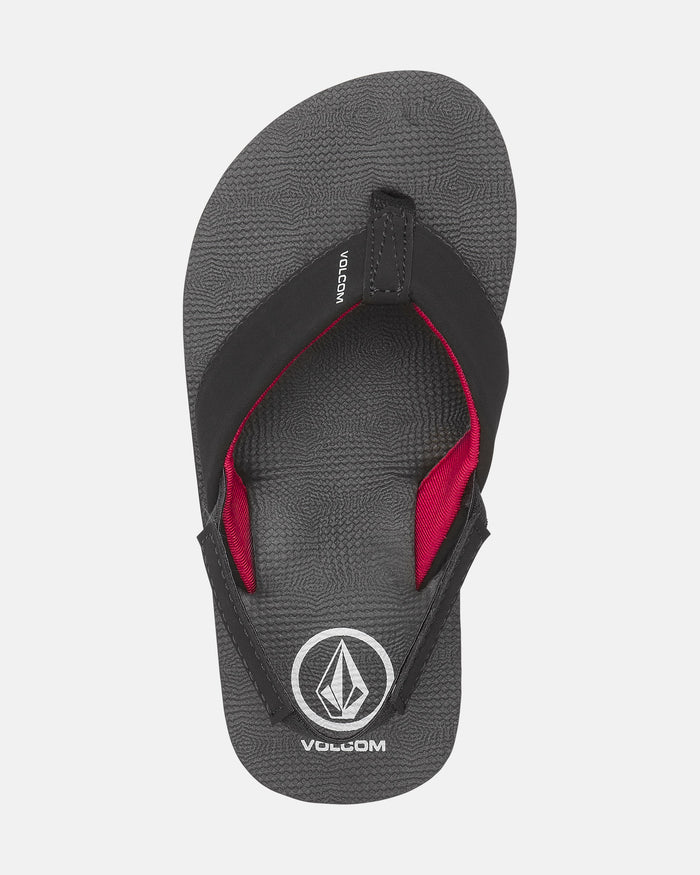 The Volcom Kids' Victor 2 Little Youth sandal is gray with a black and red strap, white Volcom logo on the footbed, and recliner comfort foam for extra cushioning. The product is shown against a plain white background.