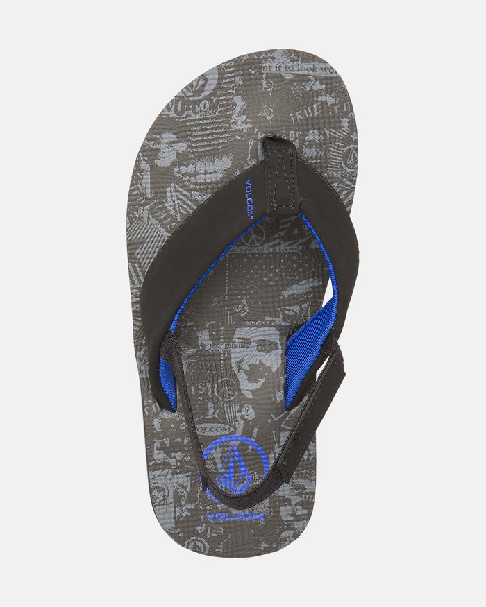 The Volcom Kids' Victor 2 Little Youth sandal features black straps, blue lining, a blue Volcom logo, and a gray patterned footbed with abstract designs. Recliner Comfort Foam ensures extra support. Black and gray colorway.