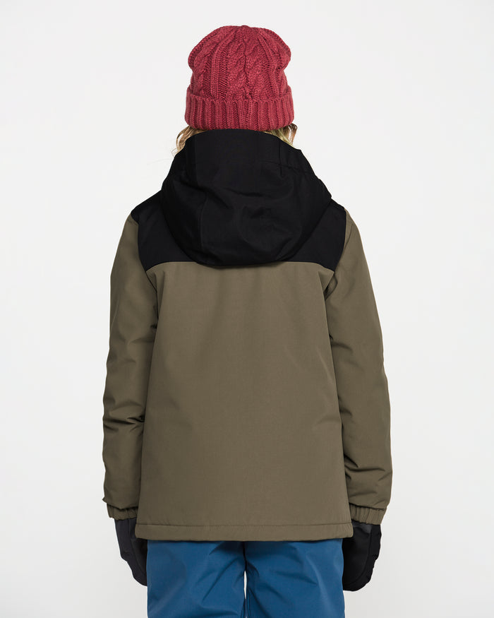 A person wearing a red knit hat, blue pants, black gloves, and the Volcom Kids’ Youth Stone.91 Insulated Jacket in green and black with recycled insulation stands facing away from the camera against a plain white background.