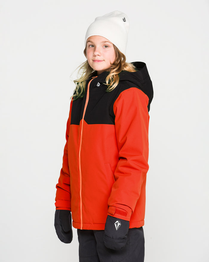 A child with blonde hair wearing a white beanie, black pants, and black gloves stands against a plain white background, dressed in the Volcom Kids’ Youth Stone.91 Insulated Jacket featuring recycled insulation and Zip Tech.