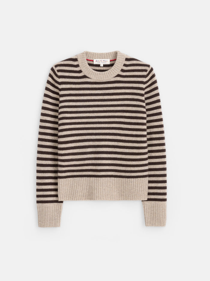 The Marais Striped Sweater in Washed Cashmere features beige and black stripes, long sleeves, and ribbed cuffs, collar, and hem. Crafted from 100% cashmere for exceptional softness, it is showcased laid flat on a white background.
