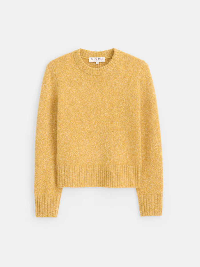 The Marais Sweater in Cashmere, shown here in yellow, features long sleeves and a classic crew neck. Crafted from 100% cashmere for exceptional softness, it is displayed laid flat on a white background.