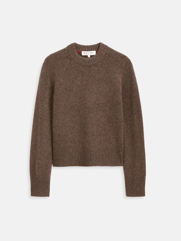 The Marais Crewneck Sweater in Cashmere is a brown, long-sleeve sweater with ribbed cuffs, hem, and neckline, crafted from soft cashmere and shown flat on a white background.