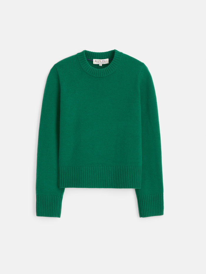 The Marais Sweater in Washed Cashmere is a vibrant green, long-sleeve luxury knit crafted from 100% cashmere, featuring ribbed cuffs, hem, and collar for added softness, shown laid flat on a white background.