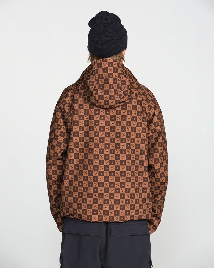 A person is facing away from the camera, wearing a black beanie and black pants, and showcasing the Volcom Men’s 2836 Insulated Jacket in brown checkered print with a repeating NS logo, against a plain white background. The jacket features V-Science 2-Layer construction for enhanced comfort and weather protection.
