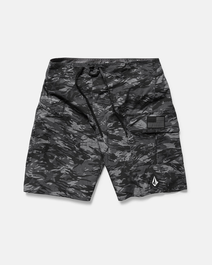 The Volcom Men's 4th Of July Preemo Mod boardshort features black and gray camouflage, Cinch Fly Technology, a drawstring waistband, side cargo pocket, and a small white geometric logo near the hem, shown flat on a white background.