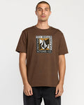 A man with short hair wears the Volcom Men's Angle Iron Short Sleeve Tee, featuring a bold geometric logo and "VOLCOM STONE CO." in a rectangular design, made from premium ring-spun cotton. He stands against a plain white background.