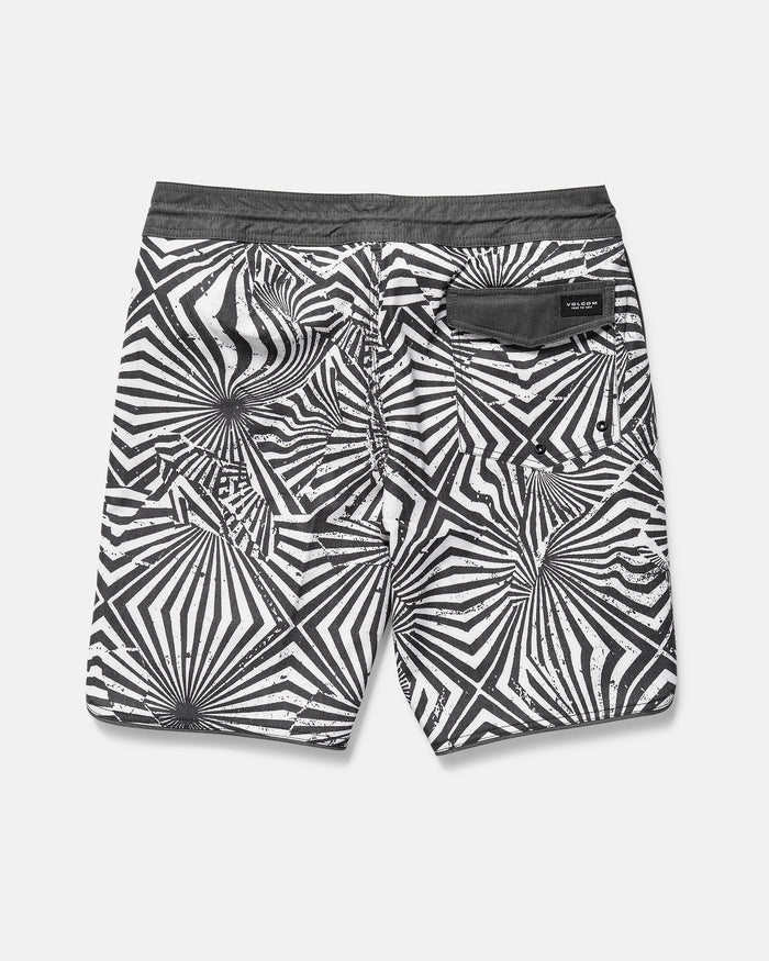 Black and white patterned shorts on a gray background