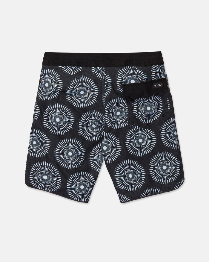The Men's Barnacle Stoney shorts by Volcom feature a black base with a white geometric circular pattern, a solid black waistband, and a back pocket adorned with a small label. Expertly crafted from a durable hemp-cotton blend, these shorts are displayed laid flat against a white background.